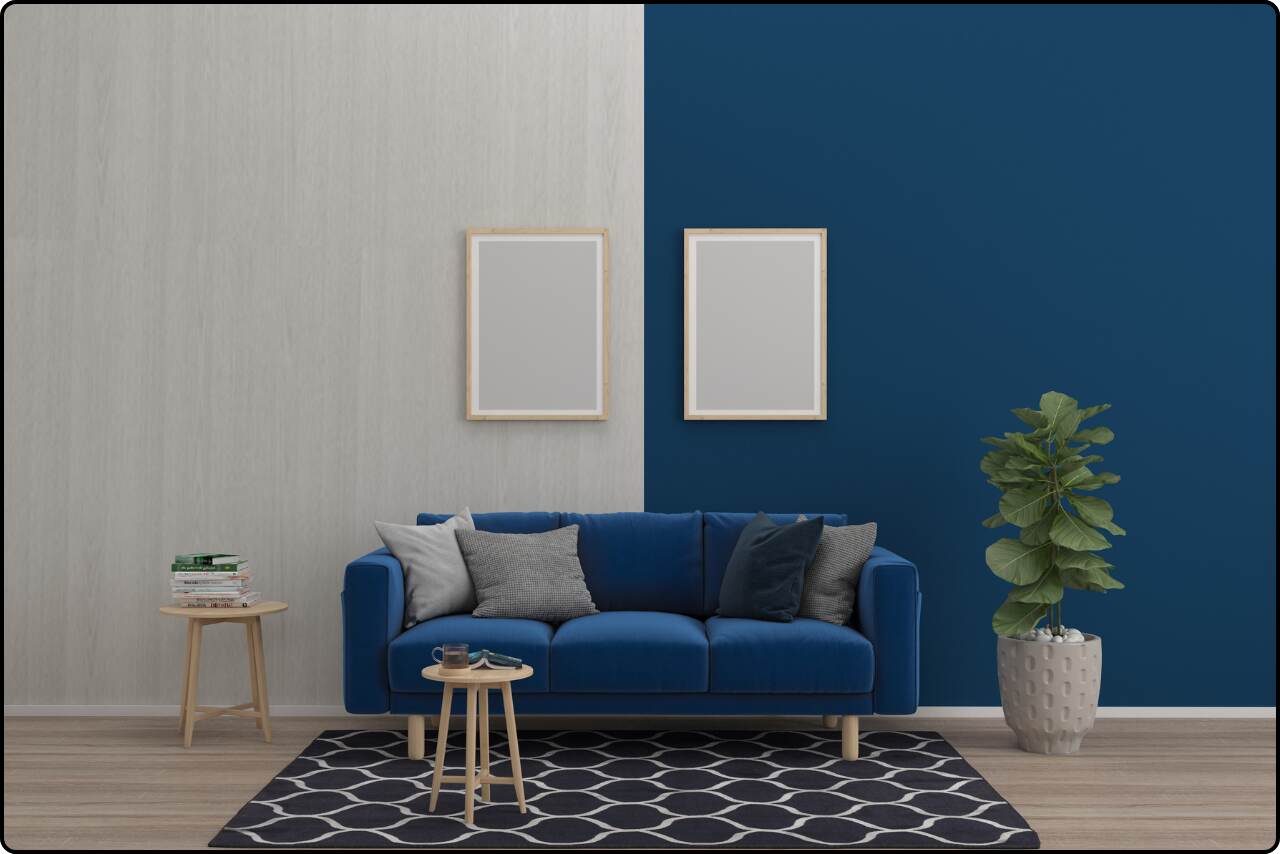 Modern living room with a sectional sofa and a feature wall painted in a bold navy blue, creating a dramatic contrast.